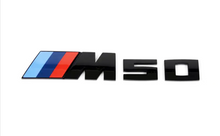 Modellschriftzüge und M Logo schwarz